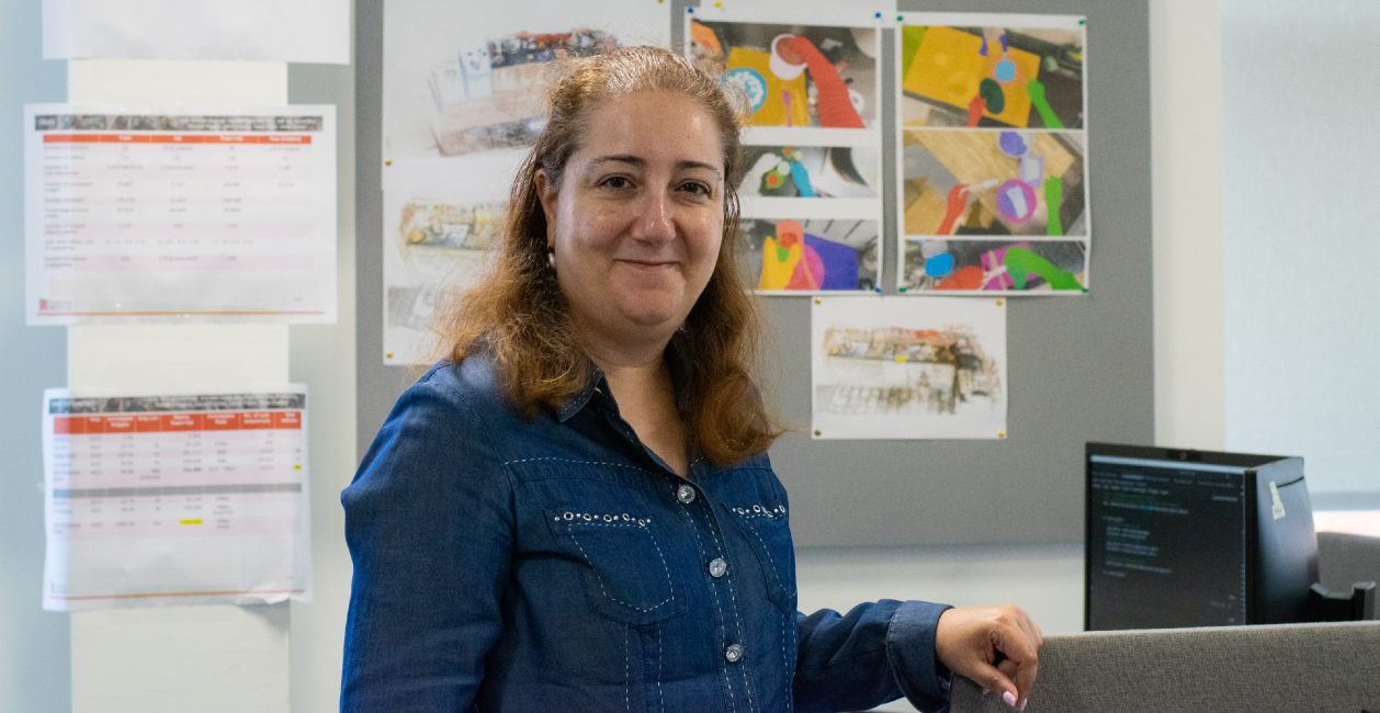 Professor Dima Damen stands in her lab